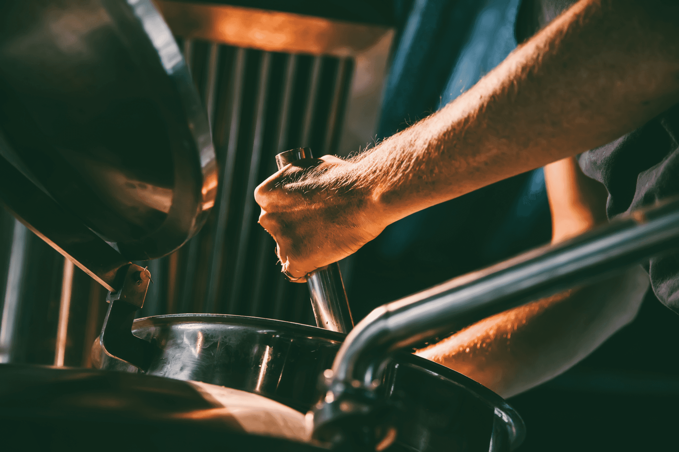 a distiller mixing up a distiller's pot